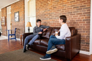 students sharing a coffee at Alumni center