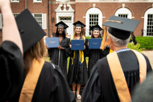 students graduating in front of lawrence hall