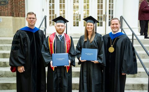 graduate students in front of townsend auditorium