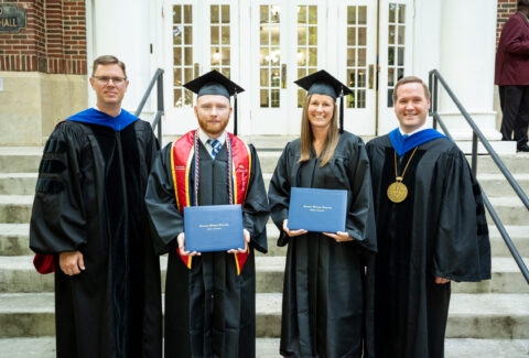 graduate students in front of townsend auditorium