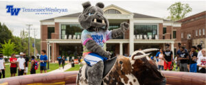Wesley at bulldog bash in front of colloms campus center