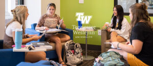 students in Colloms Campus Center studying together