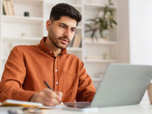 stock photo of student studying with laptop