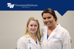two student hygienists with graphic