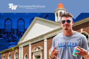 Tennessee Wesleyan student in front of Merner Pfeiffer Library with graphic
