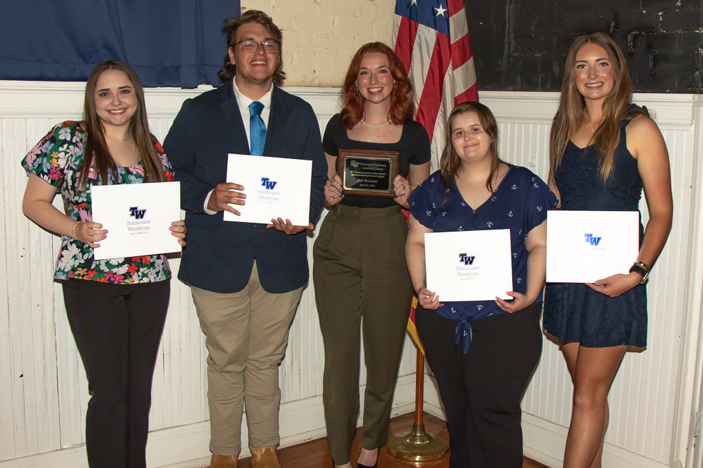 Tennessee Wesleyan students holding their awards at Honors Day