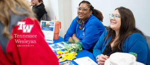 Candy and Denny at Mosher Success Center booth